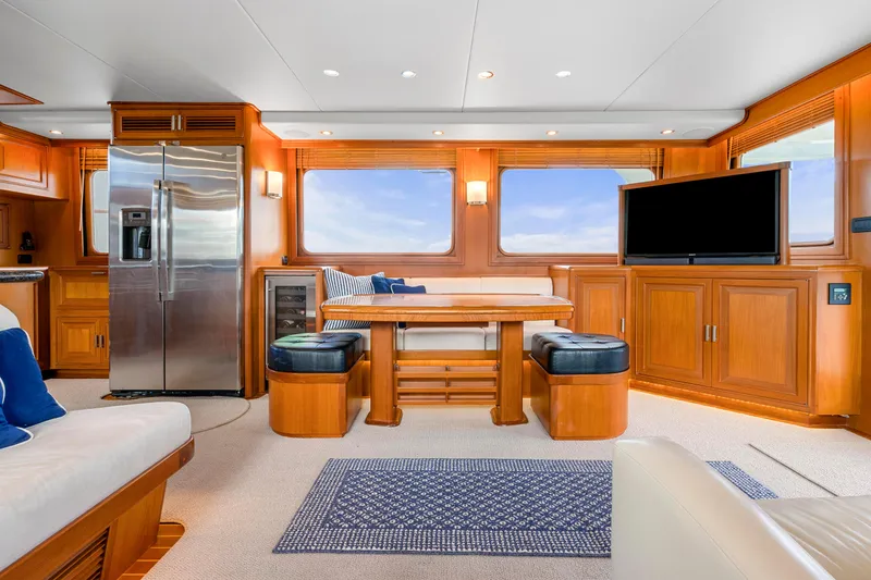 Slide: The Image of Luxurious interior of a 2007 Fleming 65 yacht with modern kitchen and dining area. - 10