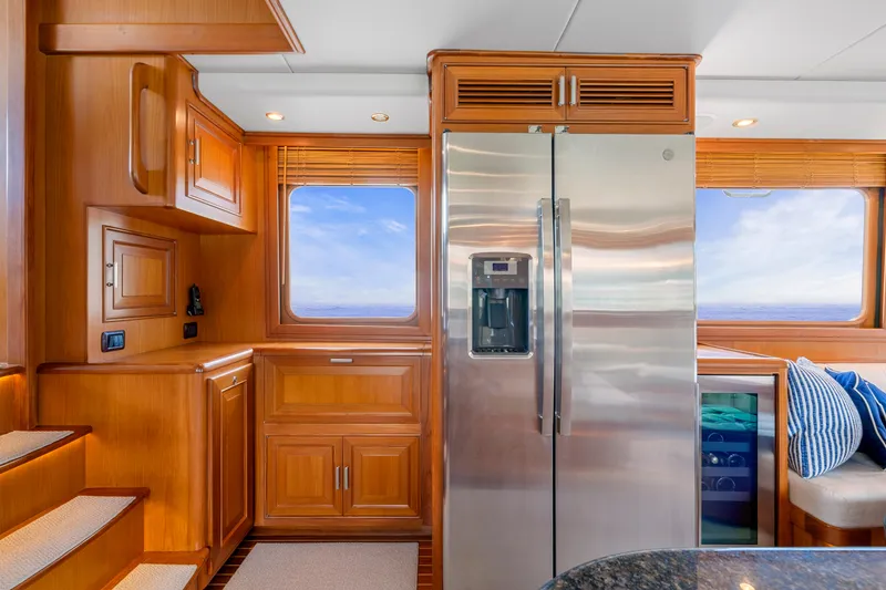 Slide: The Image of Luxurious kitchen interior of 2007 Fleming 65 yacht with wooden cabinetry and stainless steel appliances. - 11