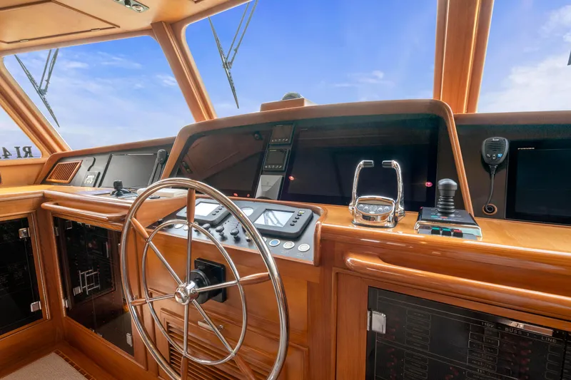 Slide: The Image of Helm of 2007 Fleming 65 yacht with steering wheel and navigation controls. - 29