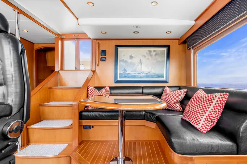 Slide: The Image of Luxurious interior of 2007 Fleming 65 yacht with elegant seating and nautical decor. - 31
