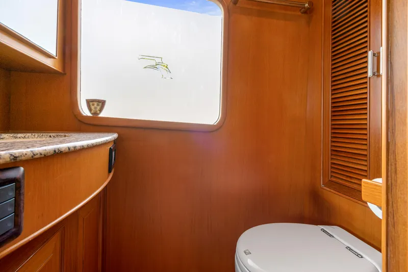Slide: The Image of Luxurious wooden bathroom interior on a 2007 Fleming 65 yacht. - 33