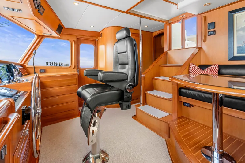 Slide: The Image of Pilothouse interior of 2007 Fleming 65 yacht with captain's chair and wooden finishes. - 35