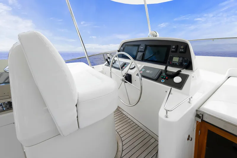 Slide: The Image of Helm of 2007 Fleming 65 yacht with ocean view and modern controls. - 38