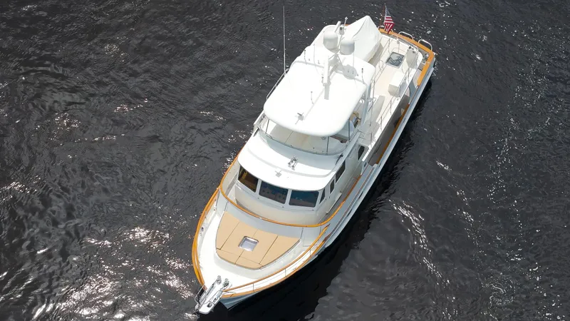 Slide: The Image of Aerial view of a 2007 Fleming 65 yacht cruising on dark water. - 47
