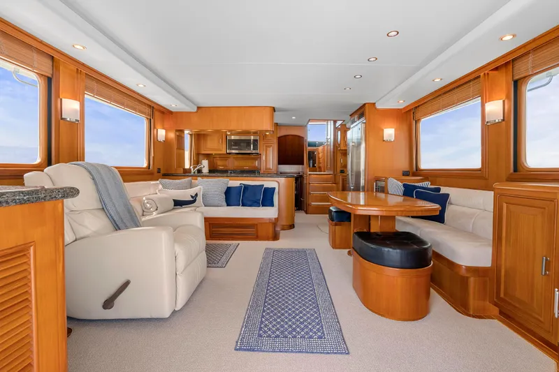 Slide: The Image of Luxurious interior of a 2007 Fleming 65 yacht with elegant wood finishes and plush seating. - 6