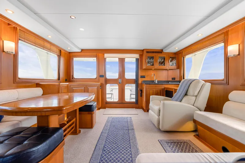 Slide: The Image of Luxurious interior of 2007 Fleming 65 yacht with elegant wood finishes and comfortable seating. - 7