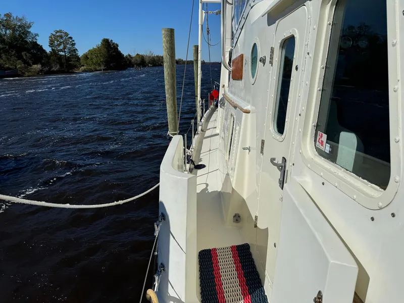 Slide: The Image of Seaton Ross 56 Trawler 1989 on calm waters, side view of deck and cabin. - 14