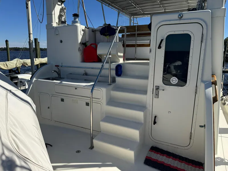 Slide: The Image of 1989 Seaton Ross 56 Trawler deck with stairs and door, featuring nautical equipment. - 15