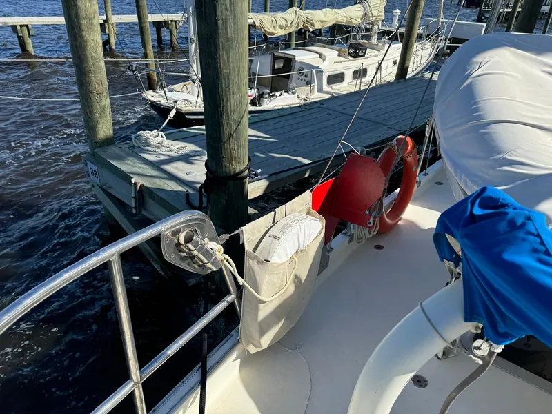 Slide: The Image of Seaton Ross 56 Trawler, 1989, docked at marina with lifebuoy and covered equipment. - 25