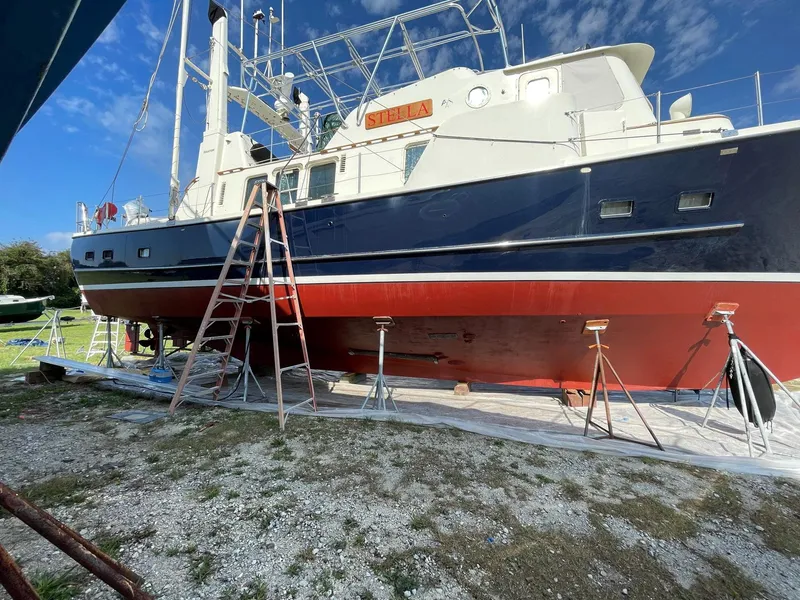 Slide: The Image of Seaton Ross 56 Trawler 1989 on dry dock with ladder and support stands. - 40