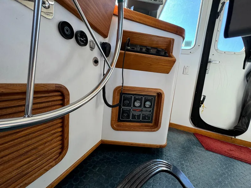Slide: The Image of Interior view of 1989 Seaton Ross 56 Trawler with control panel and wooden accents. - 43