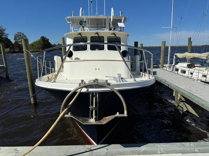 Slide: The Image of Seaton Ross 56 Trawler 1989 docked at marina, front view. - 6