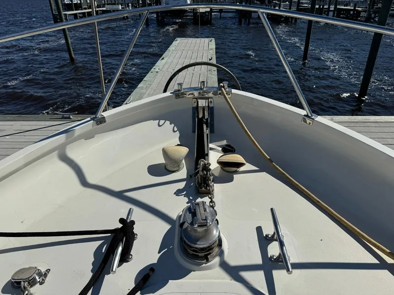 Slide: The Image of Seaton Ross 56 Trawler 1989 bow view at dock, featuring deck equipment and railing. - 9