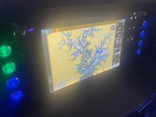 Slide: The Image of Navigation screen on 2025 Chaparral 267 SSX boat dashboard, displaying a detailed map. - 11