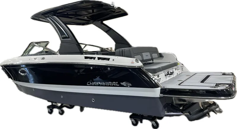Slide: The Image of 2025 Chaparral 267 SSX boat, sleek black and white design, luxury features. - 4