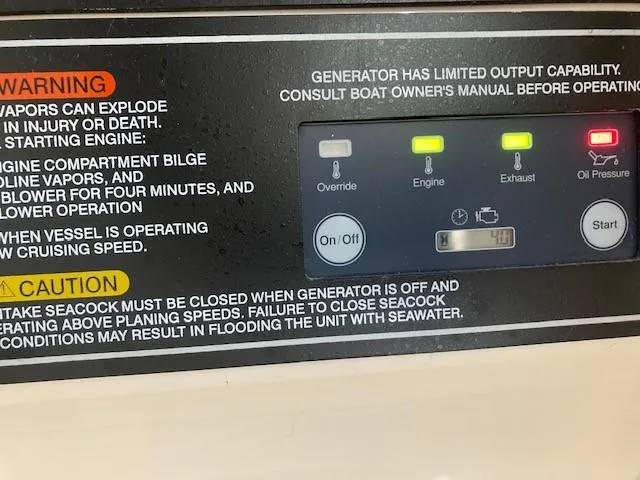 Slide: The Image of Control panel with warning labels on a 2021 Grady-White Freedom 325 boat. - 20