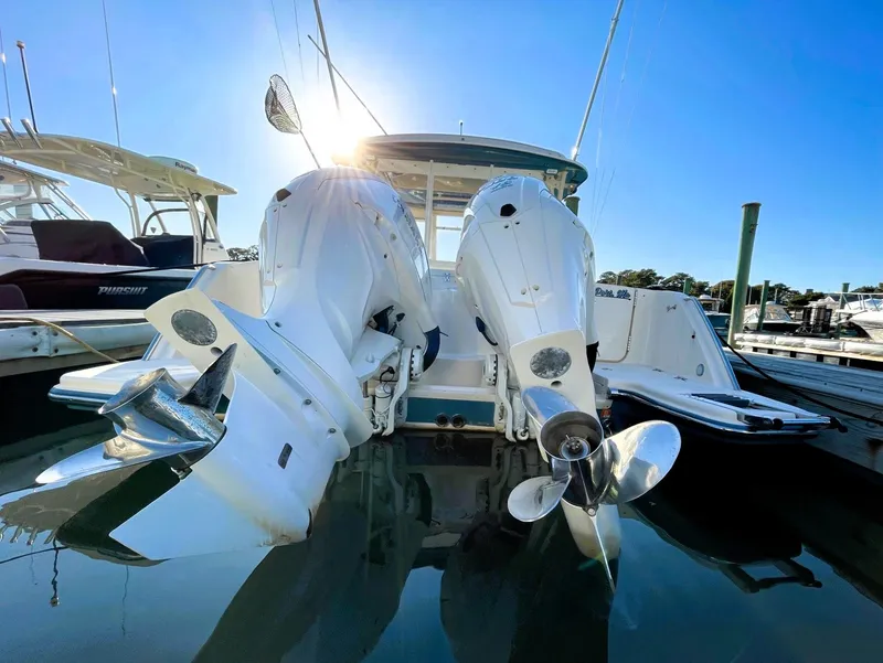 Slide: The Image of 2021 Grady-White Freedom 325 boat with dual outboard engines at marina. - 3