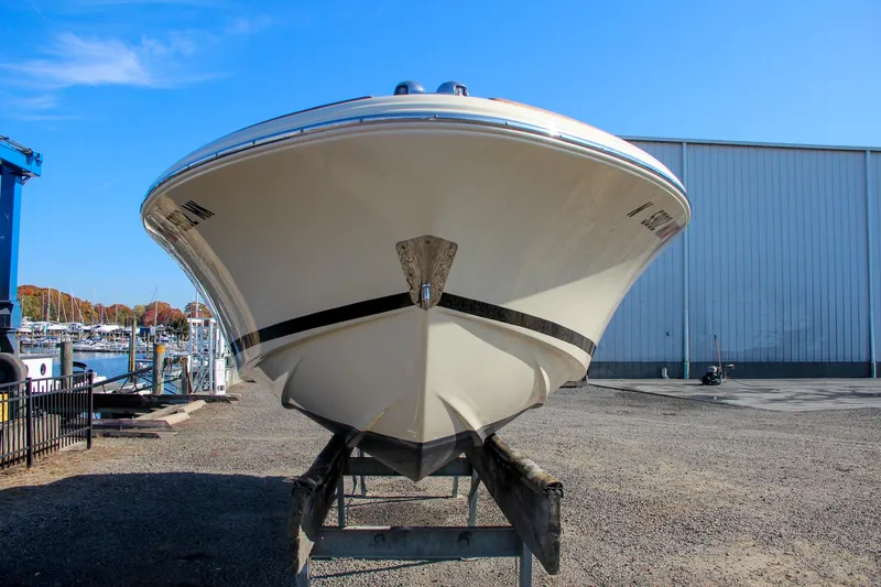 Slide: The Image of 2014 Chris-Craft Launch 22 boat on trailer, marina background. - 2