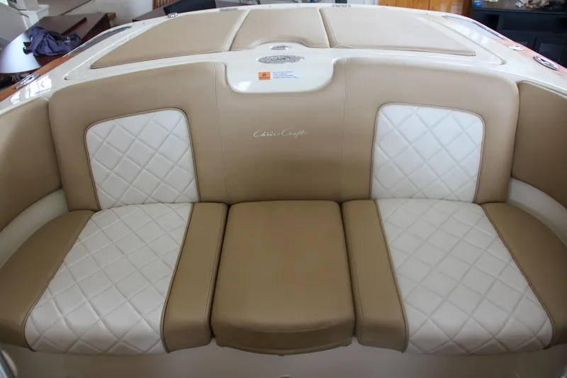 Slide: The Image of 2014 Chris-Craft Launch 22 boat interior with beige and white quilted seating. - 31