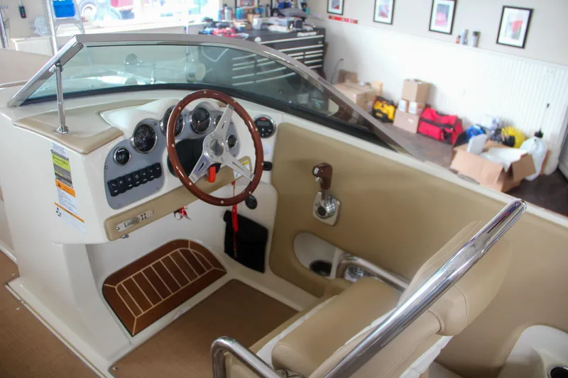 Slide: The Image of 2014 Chris-Craft Launch 22 boat interior with steering wheel and dashboard. - 42