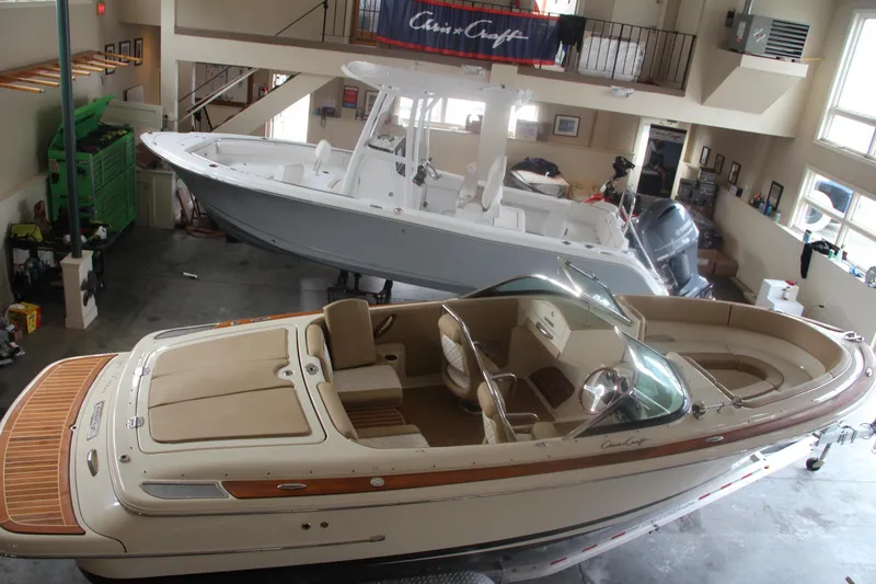 Slide: The Image of 2014 Chris-Craft Launch 22 boat in showroom, elegant design, luxury interior. - 5