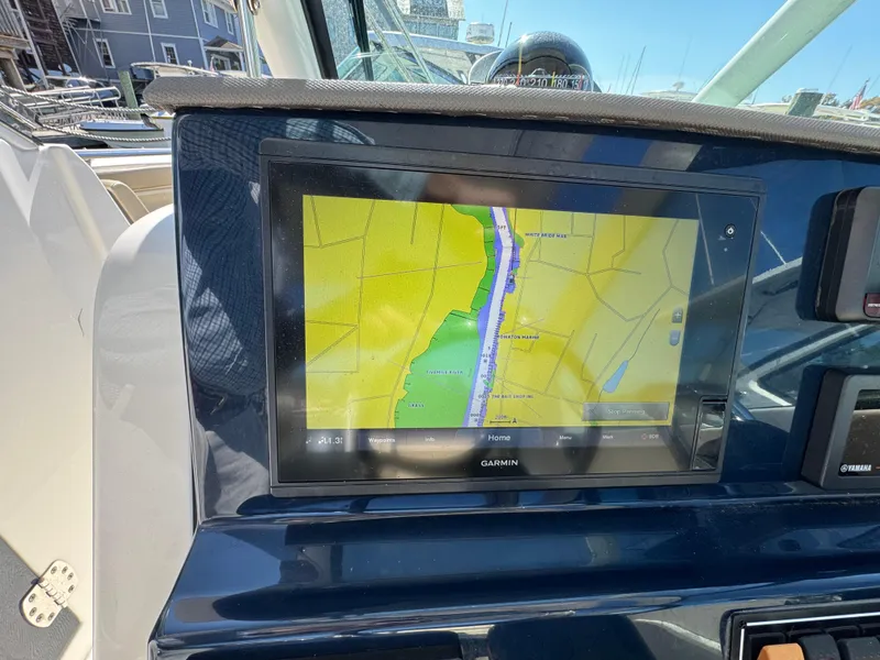 Slide: The Image of Garmin navigation display on 2020 Pursuit DC 266 Dual Console boat dashboard. - 13