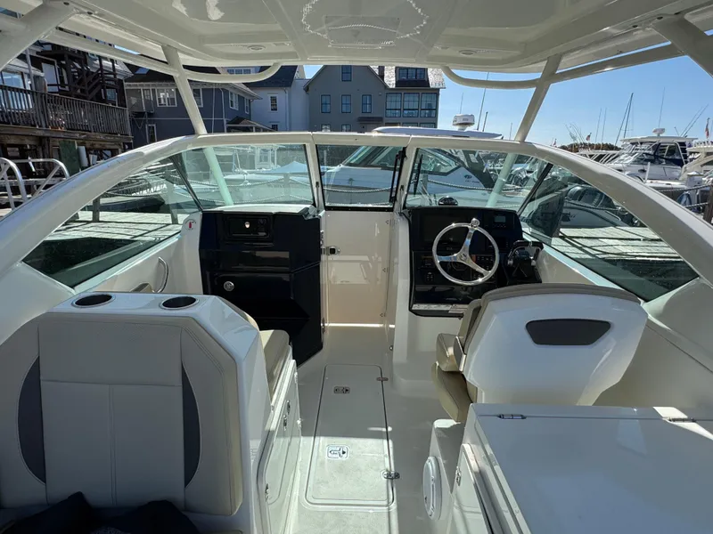 Slide: The Image of 2020 Pursuit DC 266 Dual Console boat interior with helm and seating. - 16