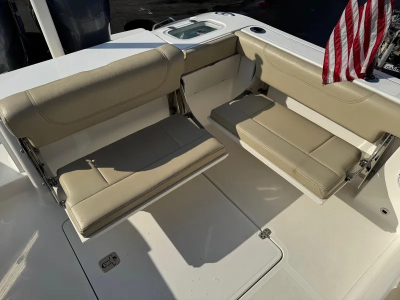 Slide: The Image of 2020 Pursuit DC 266 Dual Console boat seating with American flag. - 23