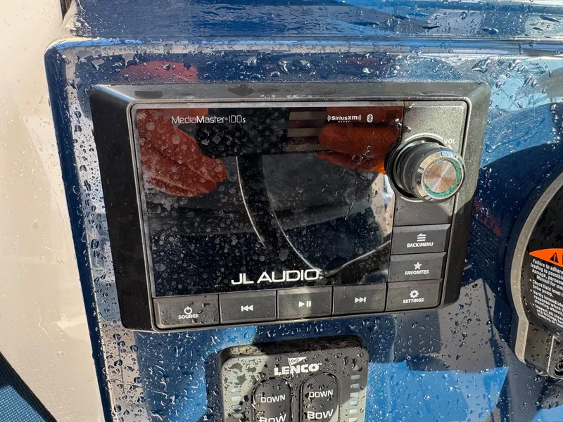 Slide: The Image of JL Audio system on 2020 Pursuit DC 266 Dual Console, wet dashboard view. - 33