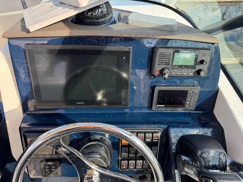 Slide: The Image of Dashboard of 2020 Pursuit DC 266 Dual Console boat with navigation equipment. - 34