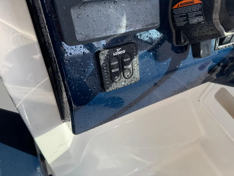 Slide: The Image of Close-up of 2020 Pursuit DC 266 Dual Console boat controls with water droplets. - 35