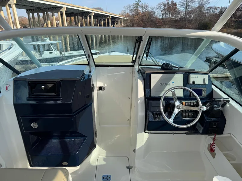 Slide: The Image of 2020 Pursuit DC 266 Dual Console boat interior with Garmin navigation system. - 37