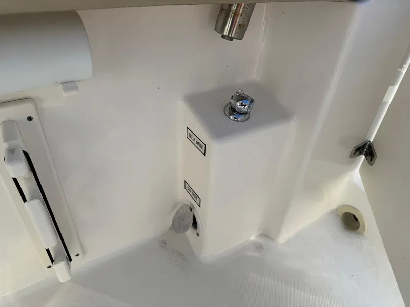 Slide: The Image of 2020 Pursuit DC 266 Dual Console boat interior detail with control panel and fixtures. - 44