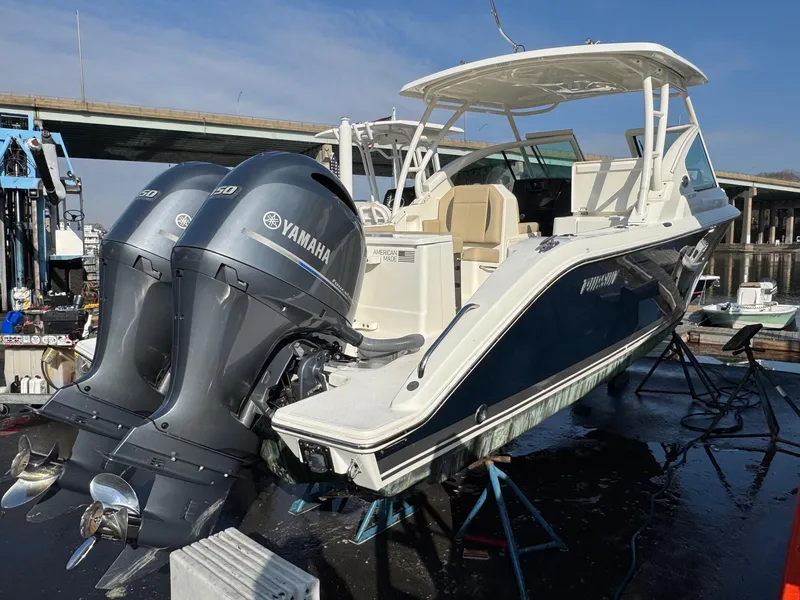 Slide: The Image of 2020 Pursuit DC 266 Dual Console boat with twin Yamaha engines docked. - 45