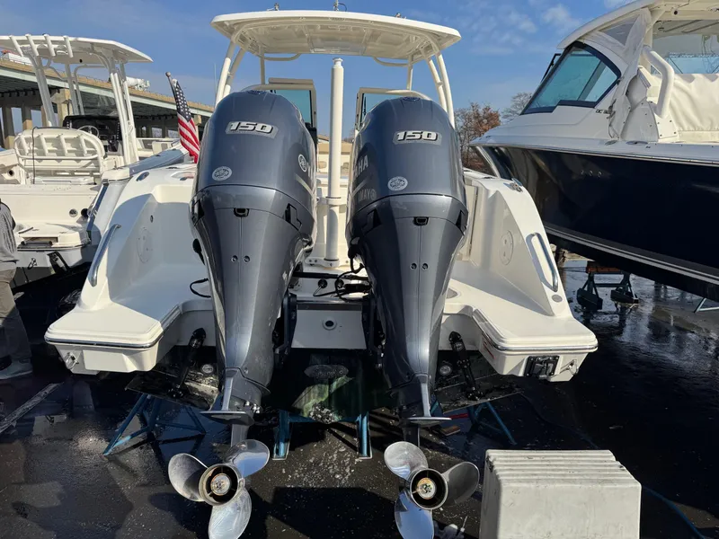 Slide: The Image of 2020 Pursuit DC 266 Dual Console boat with twin 150 horsepower engines. - 46