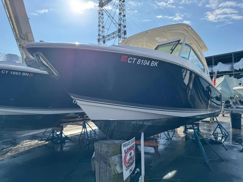 Slide: The Image of 2020 Pursuit DC 266 Dual Console boat on display at marina. - 48