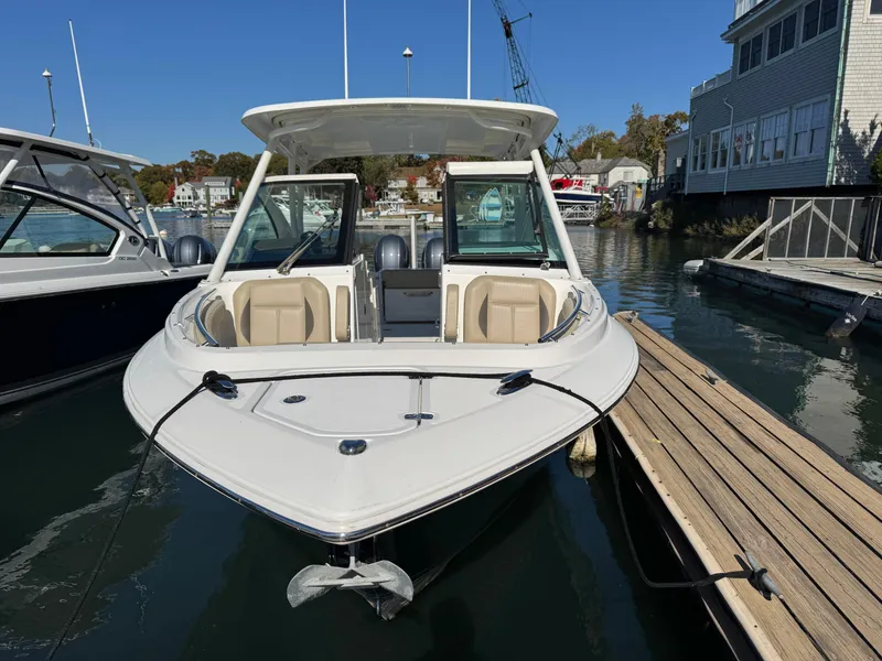 Slide: The Image of 2020 Pursuit DC 266 Dual Console boat docked at marina. - 8