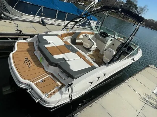 Slide: The Image of 2025 Chaparral 21 SSi boat docked, featuring spacious seating and sleek design. - 4