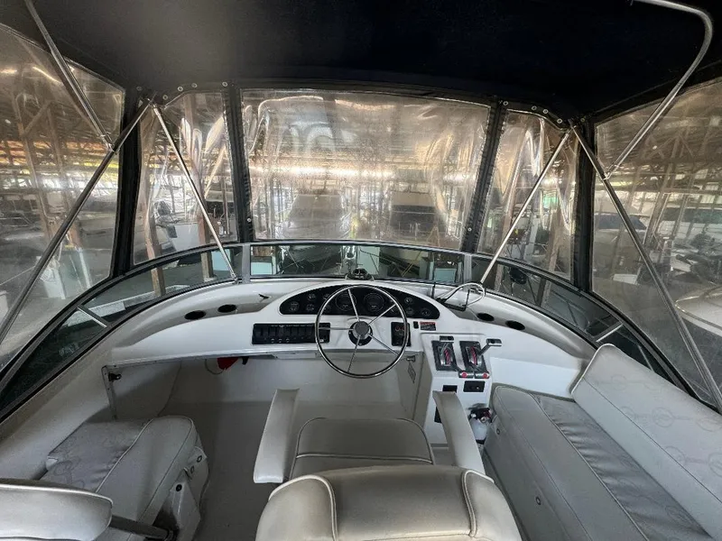 Slide: The Image of Interior view of 1999 Bayliner 3388 Command Bridge Motoryacht cockpit with steering wheel and controls. - 18