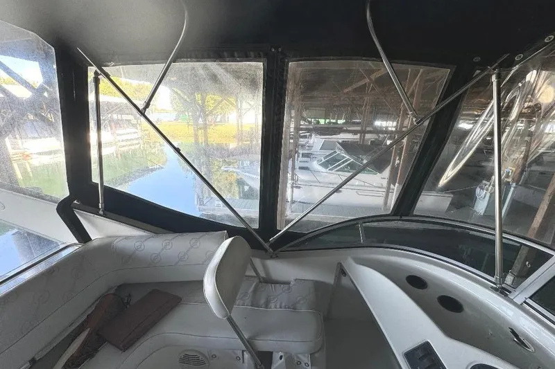 Slide: The Image of 1999 Bayliner 3388 Command Bridge Motoryacht interior with helm and seating area. - 20