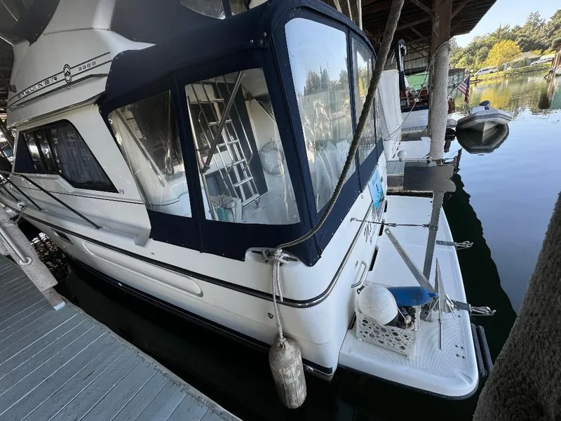 Slide: The Image of 1999 Bayliner 3388 Command Bridge Motoryacht docked in a marina. - 29