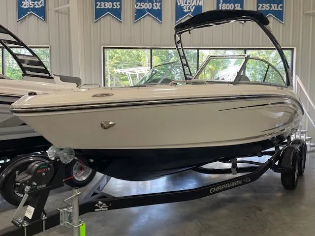 The Image of 2025 Chaparral 21 SSi boat on display in showroom, side view. - 0