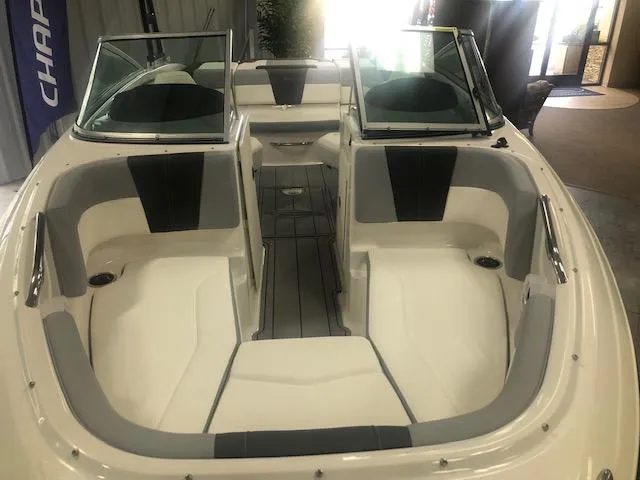 Slide: The Image of 2025 Chaparral 21 SSi boat interior with seating and windshield. - 12