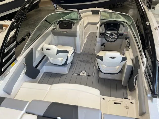 Slide: The Image of 2025 Chaparral 21 SSi boat interior with modern seating and sleek design. - 2