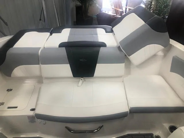 Slide: The Image of 2025 Chaparral 21 SSi boat interior with white and gray seating. - 9