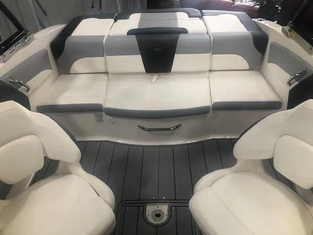 Slide: The Image of 2025 Chaparral 21 SSi boat interior with white and gray seating. - 10