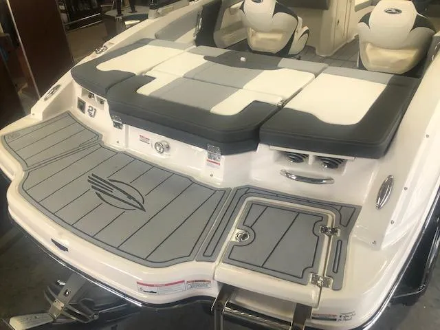 Slide: The Image of 2025 Chaparral 21 SSi boat dashboard with steering wheel and digital display. - 6