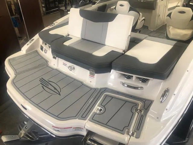 Slide: The Image of 2025 Chaparral 21 SSi boat with sleek gray and white seating and deck design. - 7