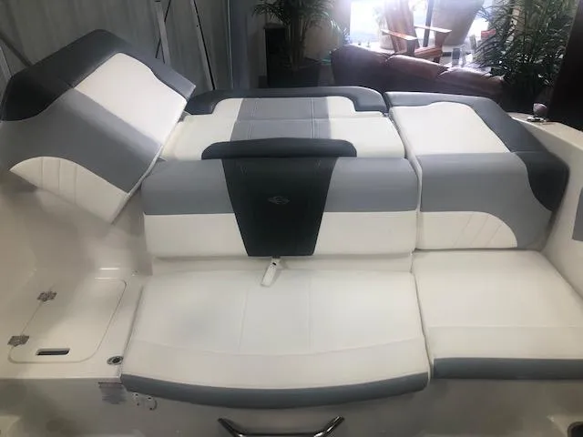 Slide: The Image of 2025 Chaparral 21 SSi boat interior with cushioned seating and sleek design. - 8