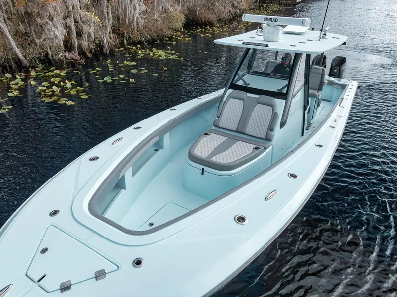 Slide: The Image of 2024 Front Runner 36 Center Console boat on a serene waterway. - 11